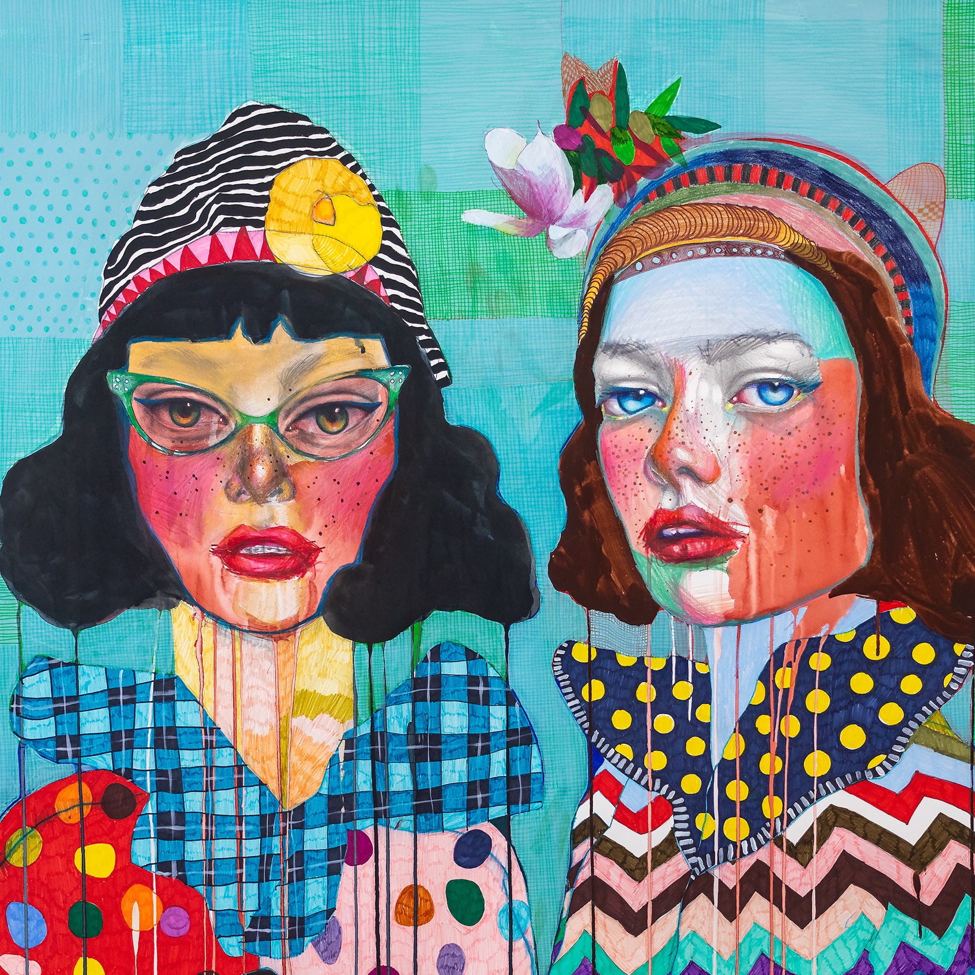 Close-up of a fine art print featuring two women with intricate patterns and vivid colors.